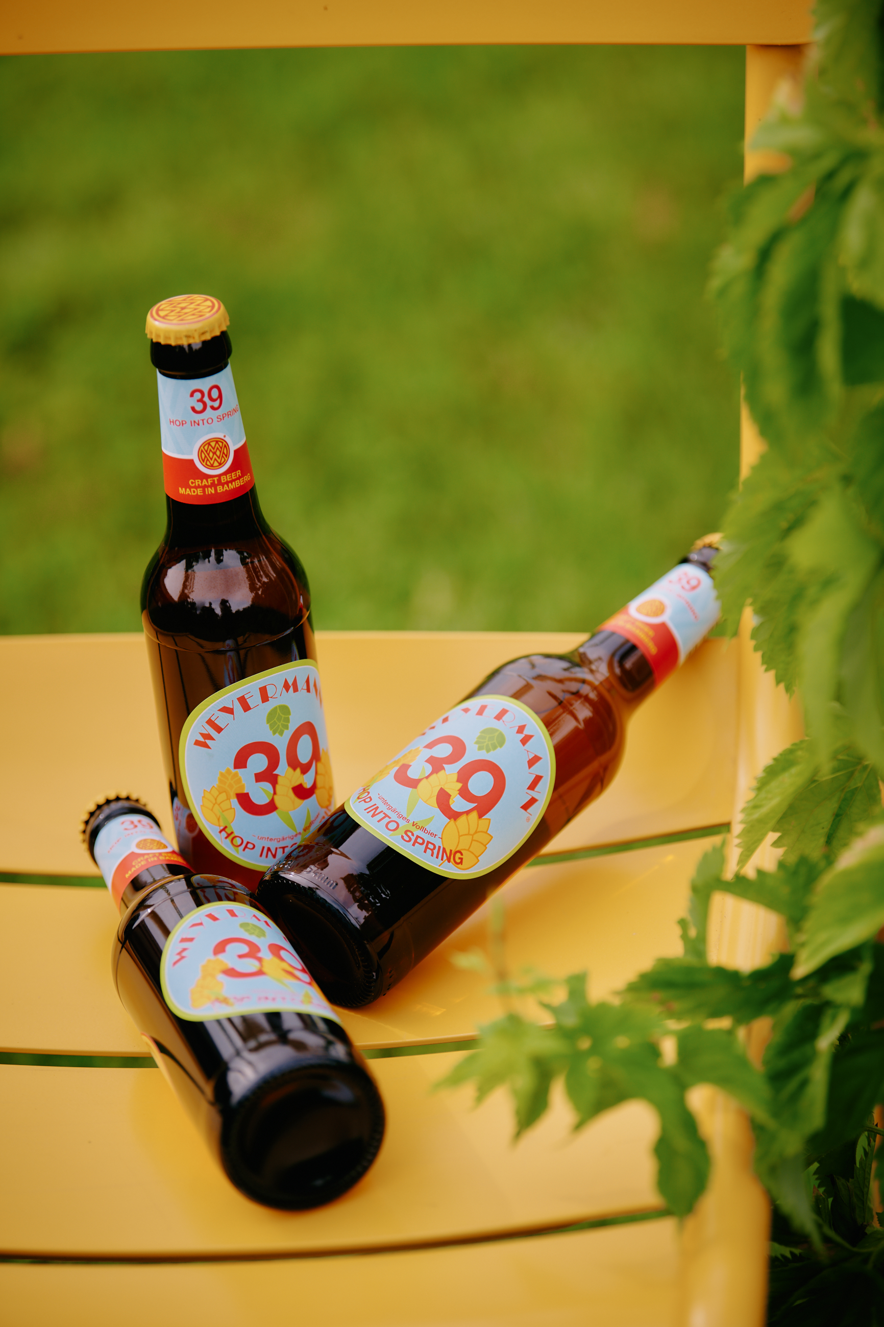 Weyermann beer malt in a glass jar with a wooden spoon